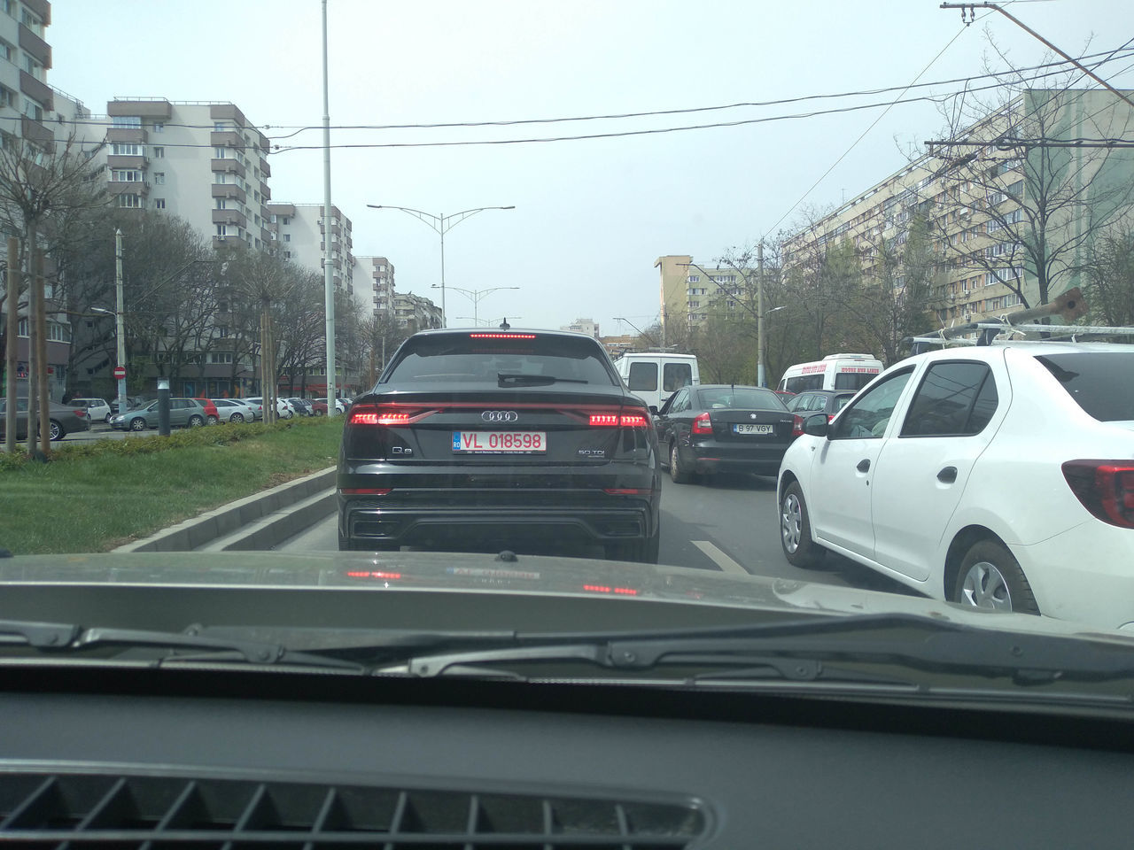 VEHICLES ON ROAD IN CITY