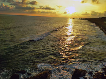 Scenic view of sea against sky during sunset