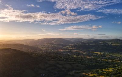 Aerial view of landscape against sky during sunset