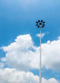 Low angle view of floodlight against blue sky on sunny day