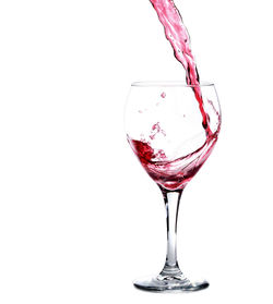 Close-up of wineglass on glass against white background