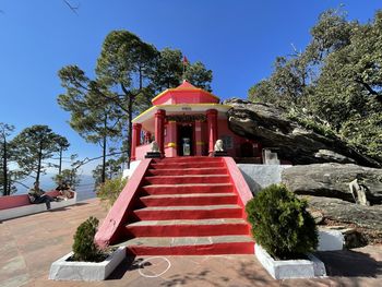 Red temple against sky