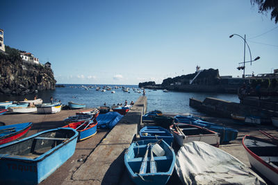 Boats moored at harbor