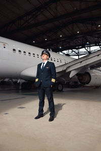 Rear view of man standing on airport