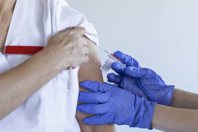 Female doctor receiving covid-19 vaccine