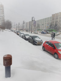 Traffic on road in city during winter