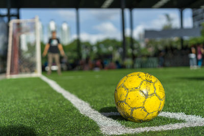 Close-up of soccer ball on field