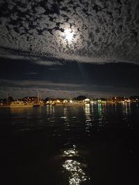 Scenic view of sea against sky at night