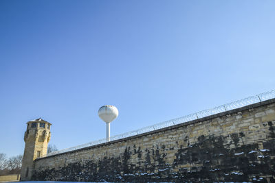 Historical abandoned prison tower and wall