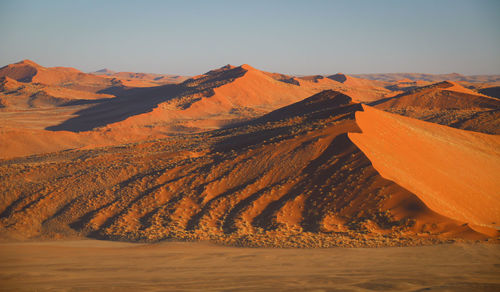 Scenic view of desert against sky during winter