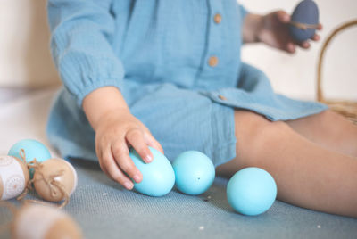 Close-up of baby playing with ball on table