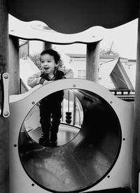 Full length of girl playing against the sky