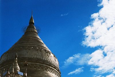 Low angle view of built structure against blue sky