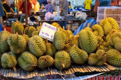 Durians for sale at market stall