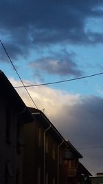 Low angle view of building against cloudy sky