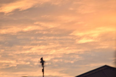 Low angle view of cloudy sky at sunset