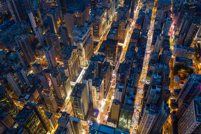 Aerial view of illuminated buildings in city at night