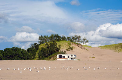 A motor home is parked in the dunes lot off of lake michigan in michigan usa