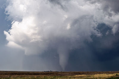 Scenic view of storm clouds over land