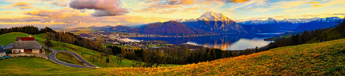 Panoramic shot of land and mountains against sky during autumn