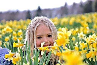 Portrait of cheerful girl in field