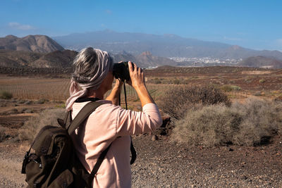 Senior woman hiking at remote location