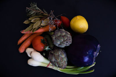 Close-up of fruits against black background