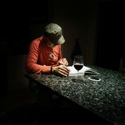 Man sitting on table at home