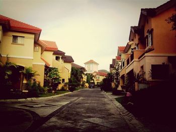 Road leading towards buildings