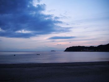 Scenic view of beach at sunset