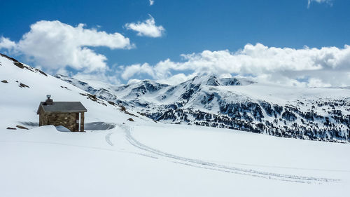 Snow covered mountain against sky