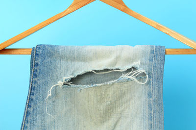 Low angle view of clothes hanging on clothesline against clear sky