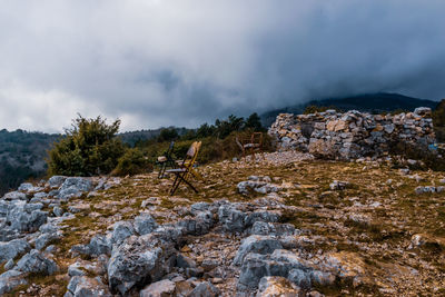 Rocks on mountain against sky