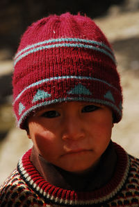 Portrait of boy wearing red hat