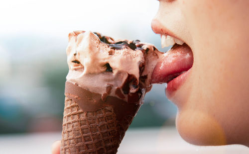 Close-up of woman eating ice cream 