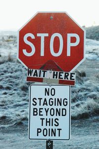 Close-up of road sign on snow