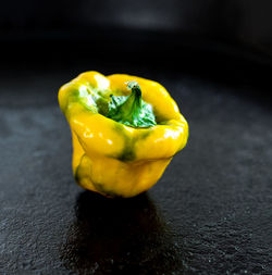 Close-up of yellow bell peppers on table