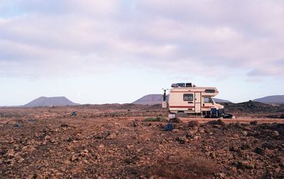 Travel trailer parked on barren landscape