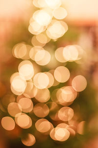 Defocused image of illuminated christmas tree