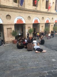 People sitting at town square