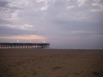 Scenic view of beach against sky during sunset