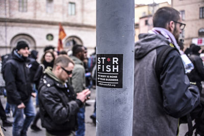 People standing on street in city