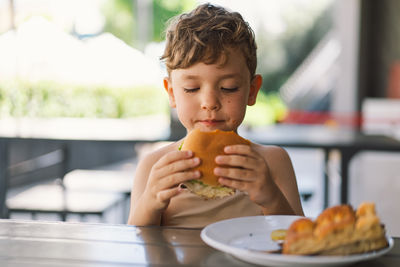 Close-up of boy eating food