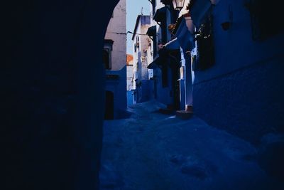 Alley amidst buildings in city