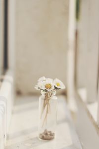 Close-up of white flower vase on table