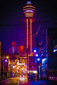 Low angle view of illuminated buildings at night