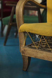 Close-up of empty chair on table