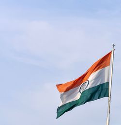 Low angle view of flags flag against sky