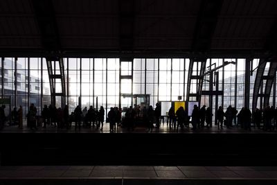 People waiting at railroad station platform