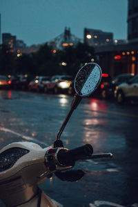 Close-up of wet car on street